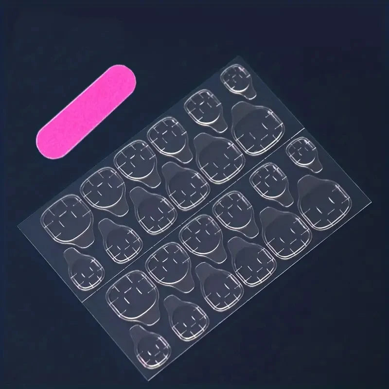 A full set of 24 medium-size coffin-shaped fake nails, crafted with gradient and smudge techniques and adorned with fuchsia flor